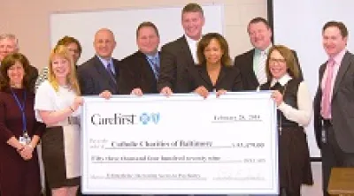 People holding an over-sized check