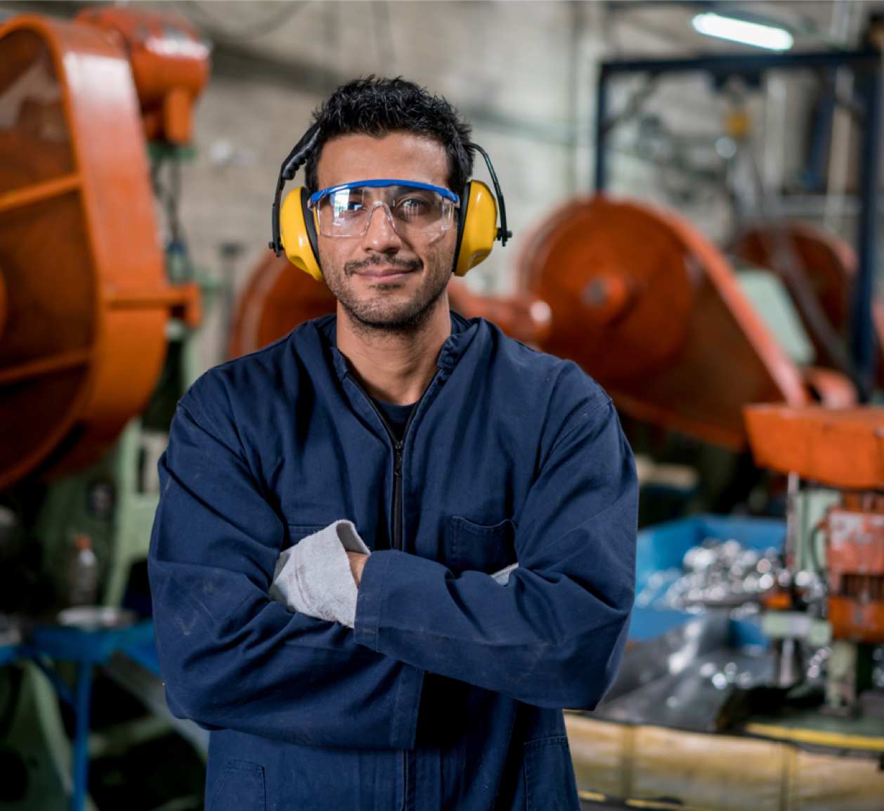 Man wearing goggles and sound ear muffs
