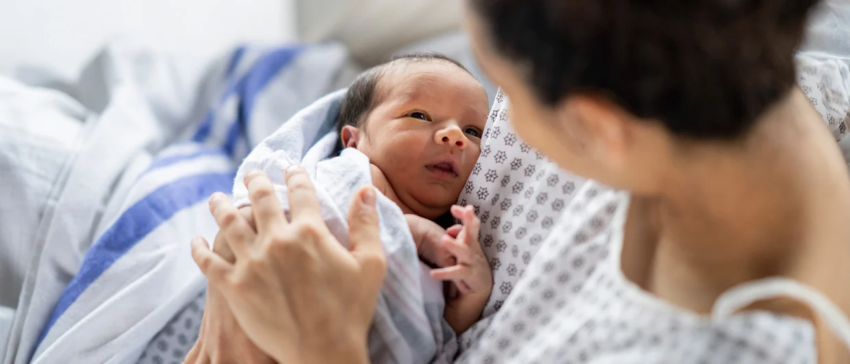 Woman with new born baby