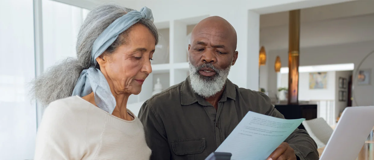 Older couple looking at a bill