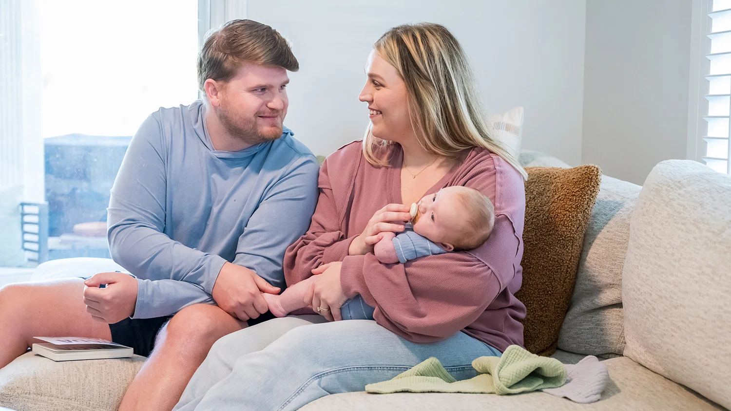 Family with baby exploring affordable healthcare options