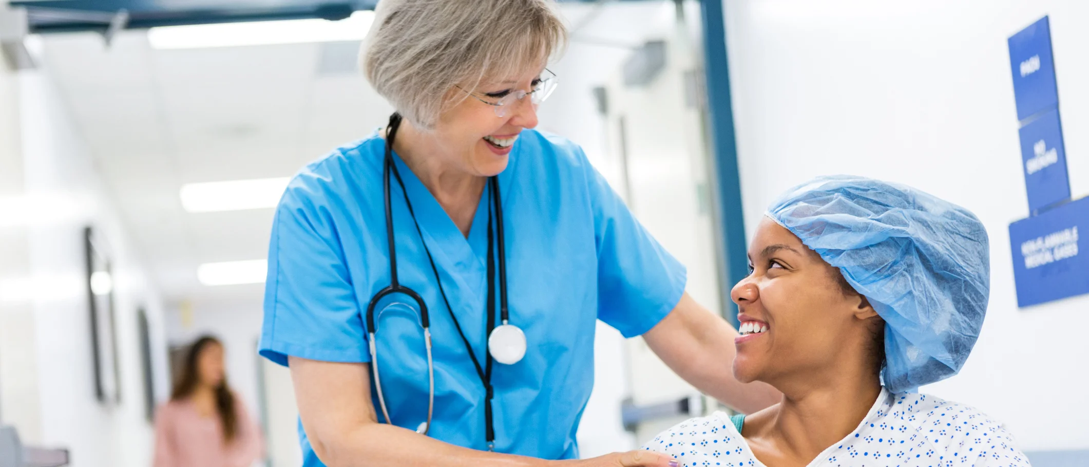 Clinician assisting a patient in a hospital