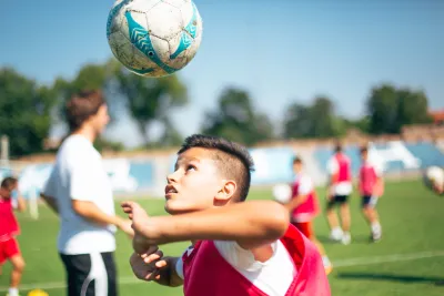 A child playing soccer in the US