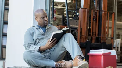 Man reading a book on his lunch break