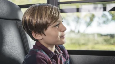 child sitting in bus