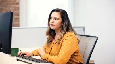 Woman sitting at her computer in an office