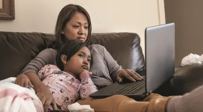Mom and daughter using Blue Shield California's virtual triage tool instead of going to the ER for corona virus symptoms