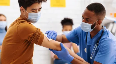 doctor swabbing patients arm