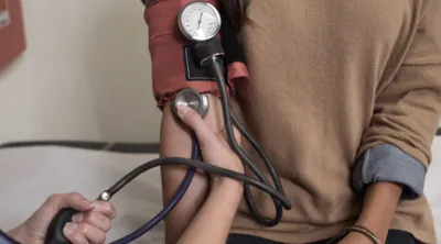 Person getting their blood pressure taken