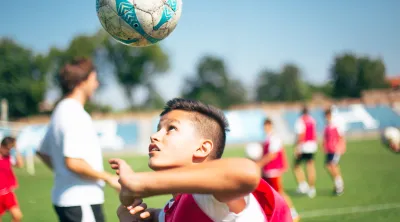 A child playing soccer in the US
