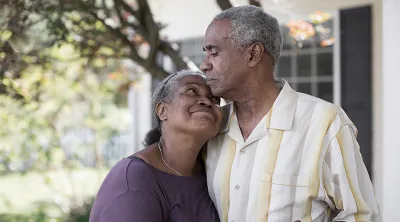 Elderly couple embracing 
