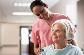 Nurse tending to an elderly patient